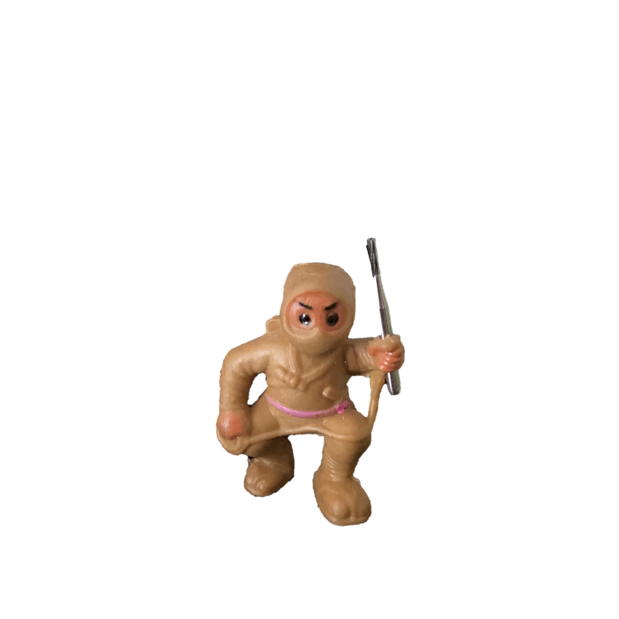 little toy ninja holding a dental bur